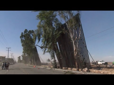 Strong winds blew over parts of Trump's new border wall with Mexico