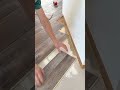 Installing interlocking vinyl planks over tiled floor surface