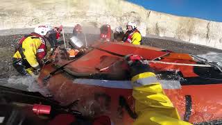 Students rescued after tide cuts them off
