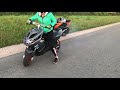 Girl learning burnout on yamaha aerox