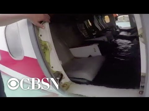 U.S. Navy sailors rescue survivors from submerged plane in Micronesia