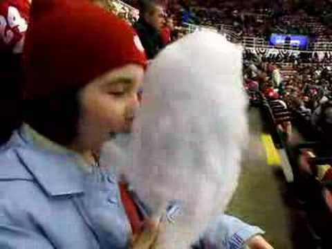 Girl eating cotton candy at Red wings game with no hands!