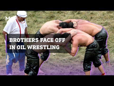 Twin brothers face each other in Turkish oil wrestling competition