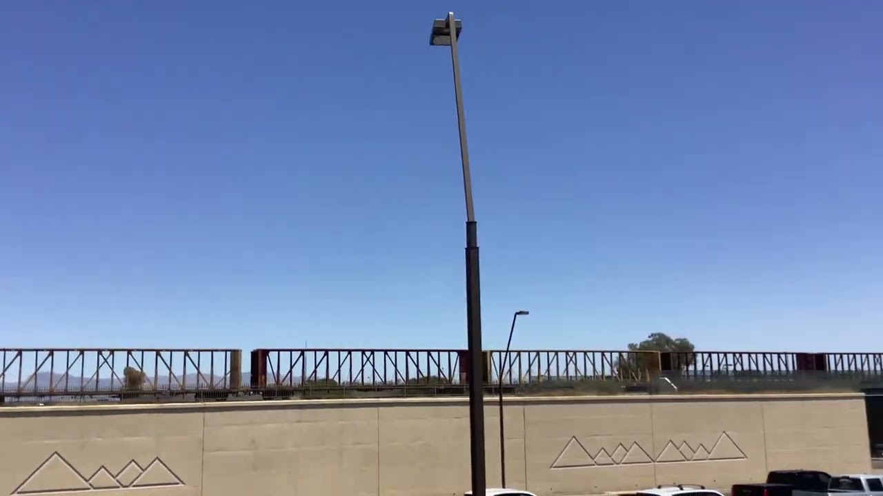 Outbound train departs Germann Siding and goes by Ellsworth Loop Rd