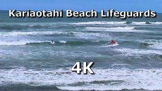Kariaotahi Beach Lifeguards using a RIB out on the surf in New Zealand