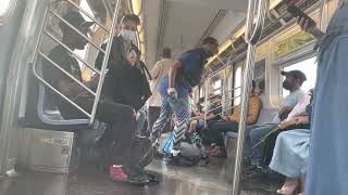 Crazy woman on NYC subway pulls out knife and stalks random guy