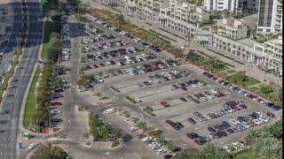 Aerial view full cars at large outdoor parking lots timelapse in Dubai, UAE.