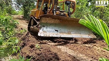 Highest risk job Caterpillar D6R XL bulldozer operator clearing plantation roads