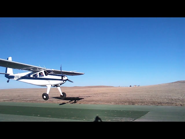 Helio Courier makes a windsock check on Runway 17 Calhan Colorado Airport.