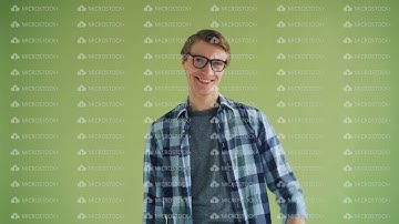 Portrait of friendly person guy waving hand looking at camera and smiling
