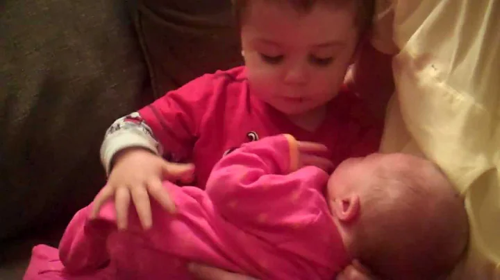 Honor Calvin McManus meets his new baby sister Mercy Geneva.