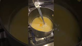 Making grits with Italian cheeses and poached eggs