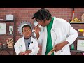 STEM NOLA Education Coordinator Chris Charles Jr. and 3-year-old son Malachi demonstrate Paper Ears