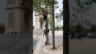 Walking up to the Arc de Triomphe in Paris from the metro station