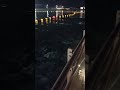 Andando sobre água iluminada na orla #satisfying #nighttime