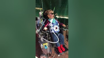 Max driving his chair to look around the sukkah (2017/10/01)