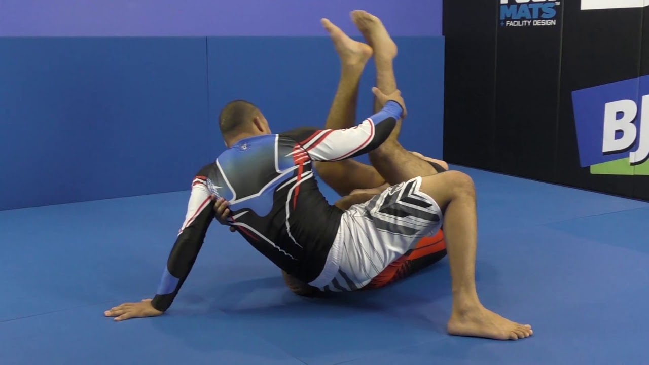 Slide Under Sweep From Reverse Half Guard by Bernardo Faria - YouTube