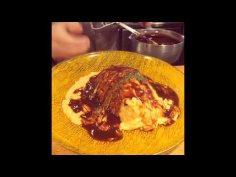 Japanese omelette is sliced onto a bed of rice