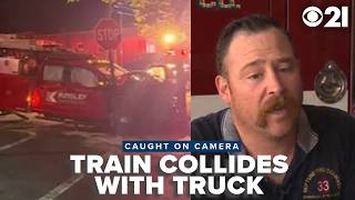 Fire crews recall saving driver from truck as train quickly approaches