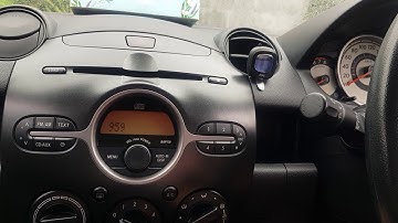 How to adjust clock settings in your Mazda 2
