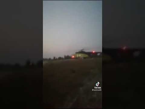 Югра.Что выгружают люди в белых костюмах?
