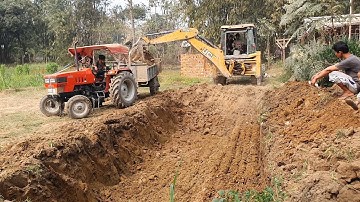 JCB Backhoe Loader Digging Ground and Loading Soil in Tractor - JCB Video