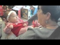 Great grandma sings baby to sleep on christmas