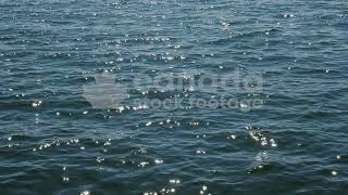 Slow motion sparkling blue lake with sun reflections stock video. Lake Ontario, Canada. HD.