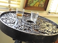 Metal Welded bar table made from scrap metal, leaf springs, iron wheel, spanners, bolts