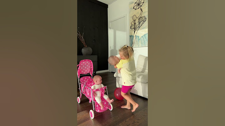 Sweet Naomi puts her dolls in the stroller. Cute Baby Videos!