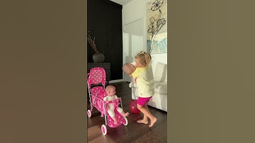 Thumbnail of Sweet Naomi puts her dolls in the stroller. Cute Baby Videos!