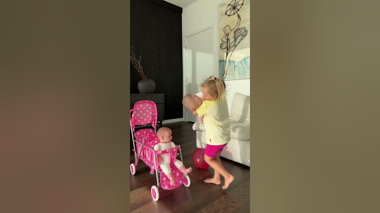 Sweet Naomi puts her dolls in the stroller. Cute Baby Videos! Sweet Naomi puts her dolls in the stroller. Cute Baby Videos!