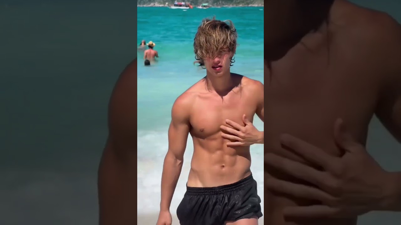 "Blonde Curly-Haired Hunk Walking on the Beach 🌊🏳️‍🌈"