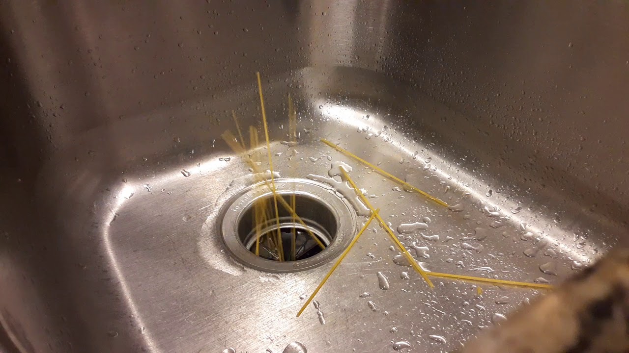 My garbage disposal eating spaghetti - YouTube