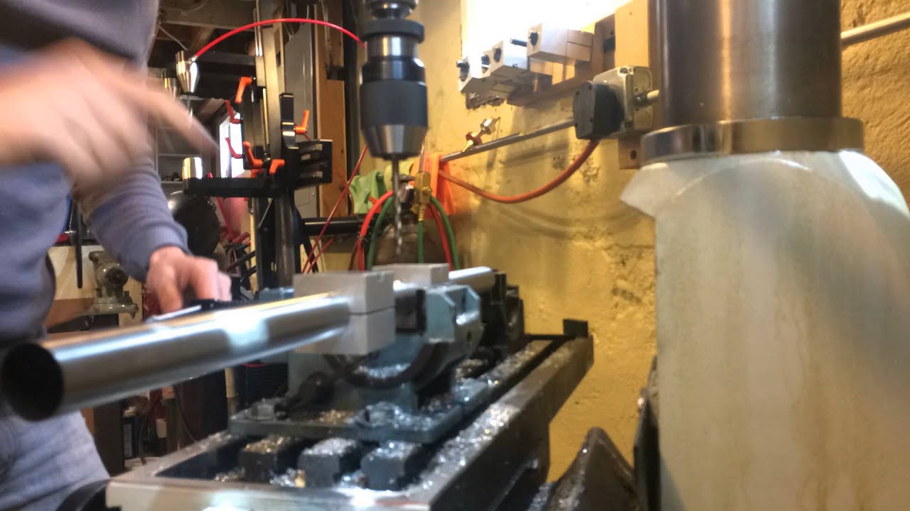 drilling holes for water bottle bosses in this machine road bike. YouTube