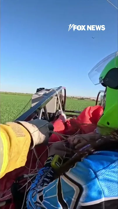 WATCH: Skydiver stuck mid-air over roadway #shorts #usa #us #viral #news