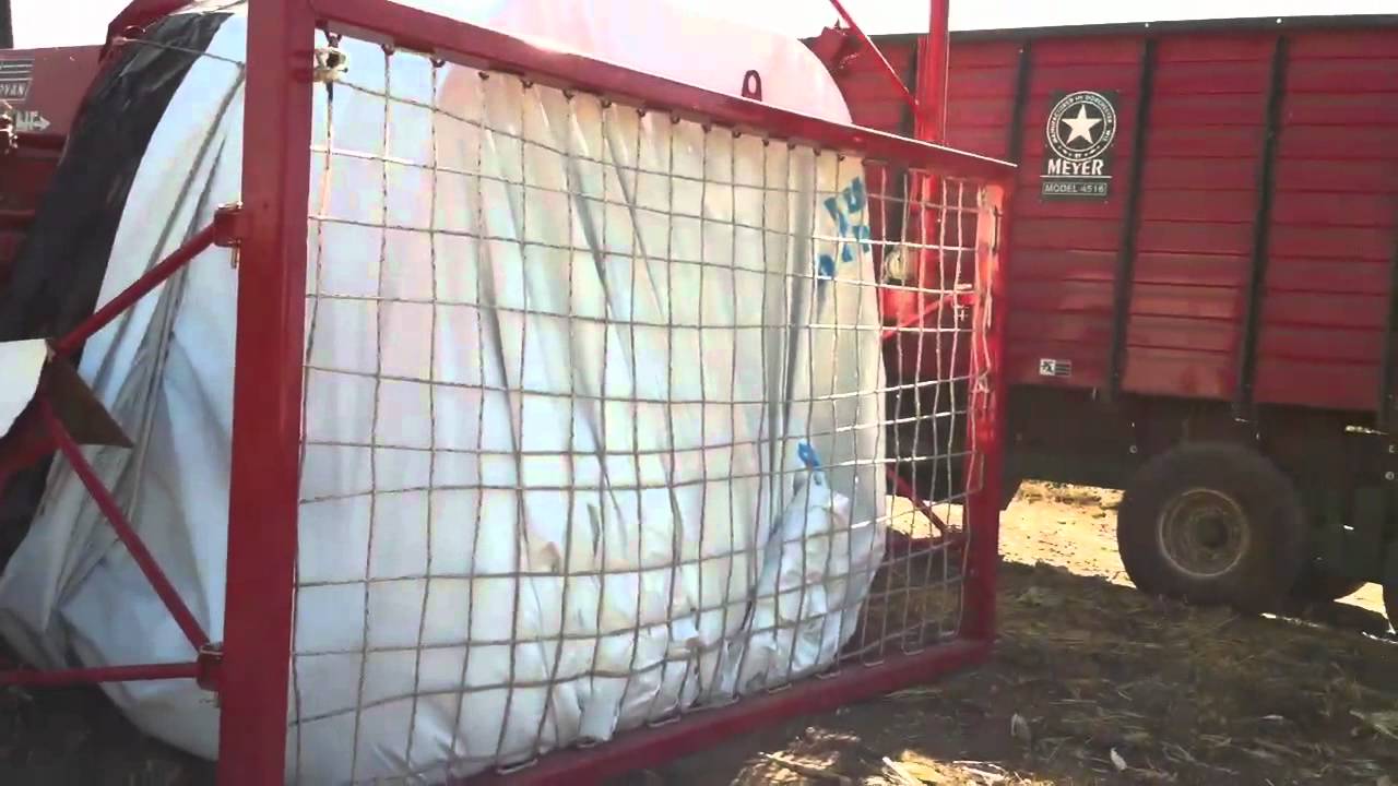Unloading organic corn silage into bagger YouTube