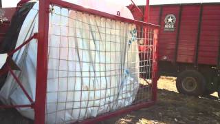 Unloading organic corn silage into bagger