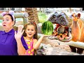 Ruby and Bonnie feed the animals at the Emirates Park Zoo