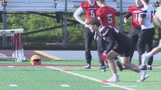 High school football players show off their skills