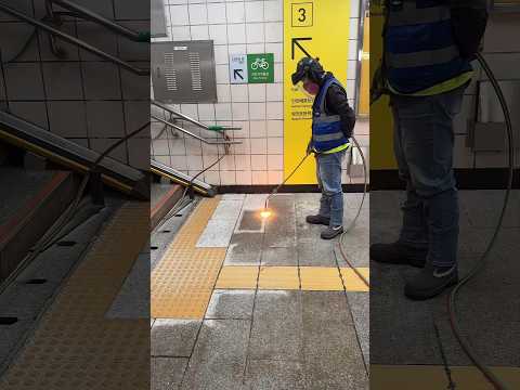 Why are they blasting subway floors with a 1,500°C flame?