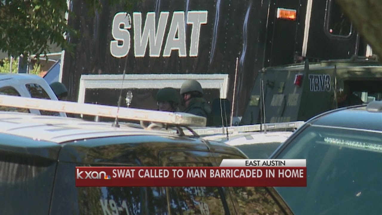 SWAT called after man barricades himself inside home - YouTube
