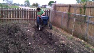 Gardening; 1963 Sears suburban tractor.