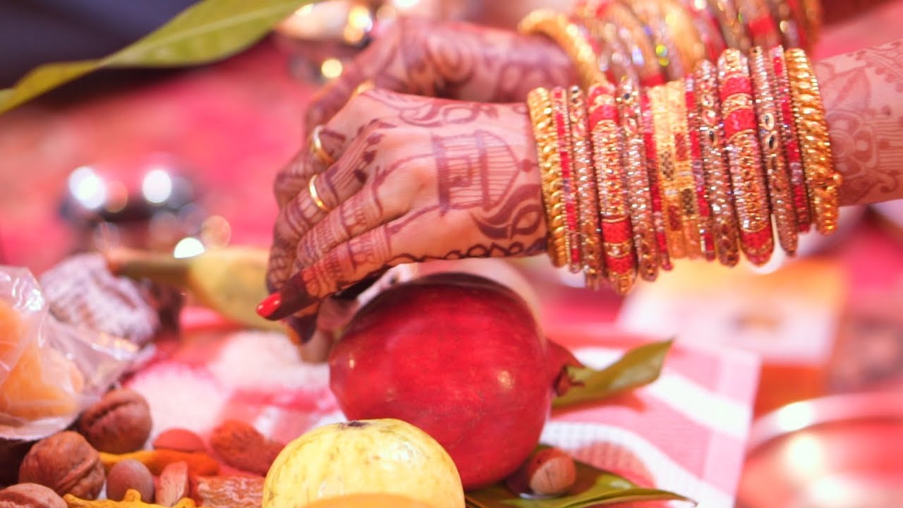 Bridegroom holding hand of bride performing ritual vidhi in maharashtrian wedding  ceremony Stock Photo - Alamy