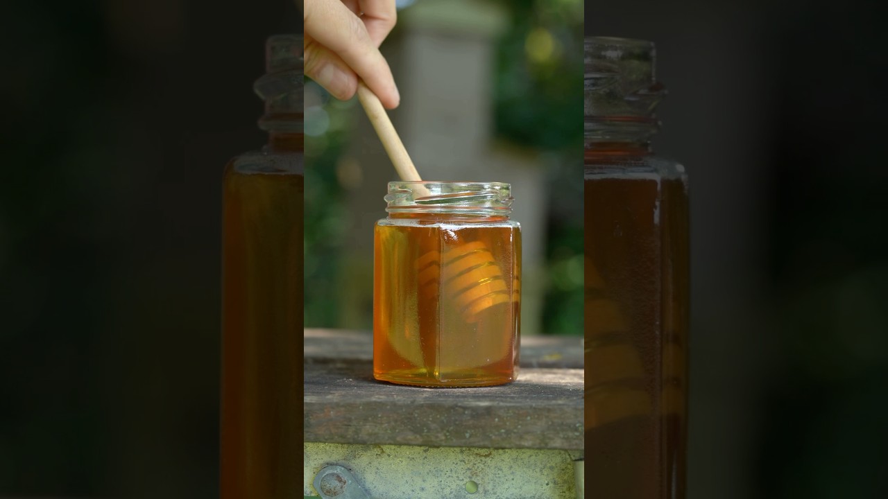 Using a honey dipper. The grooves hold the honey as you spin it 