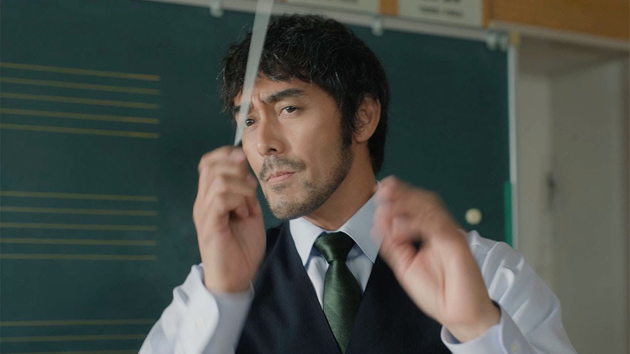 Abe Hiroshi plays a passionate music teacher, waving his baton