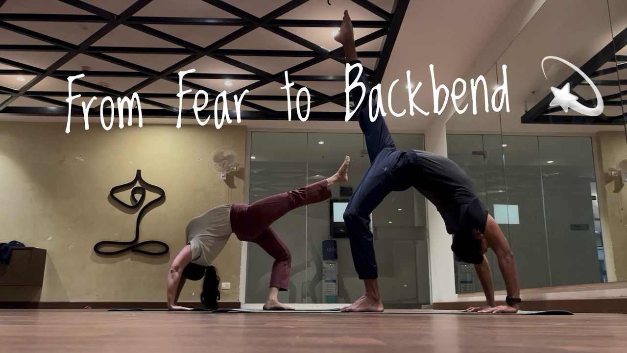 “Her First Standing Chakrasana — strength, trust, and courage unfolding with guided support