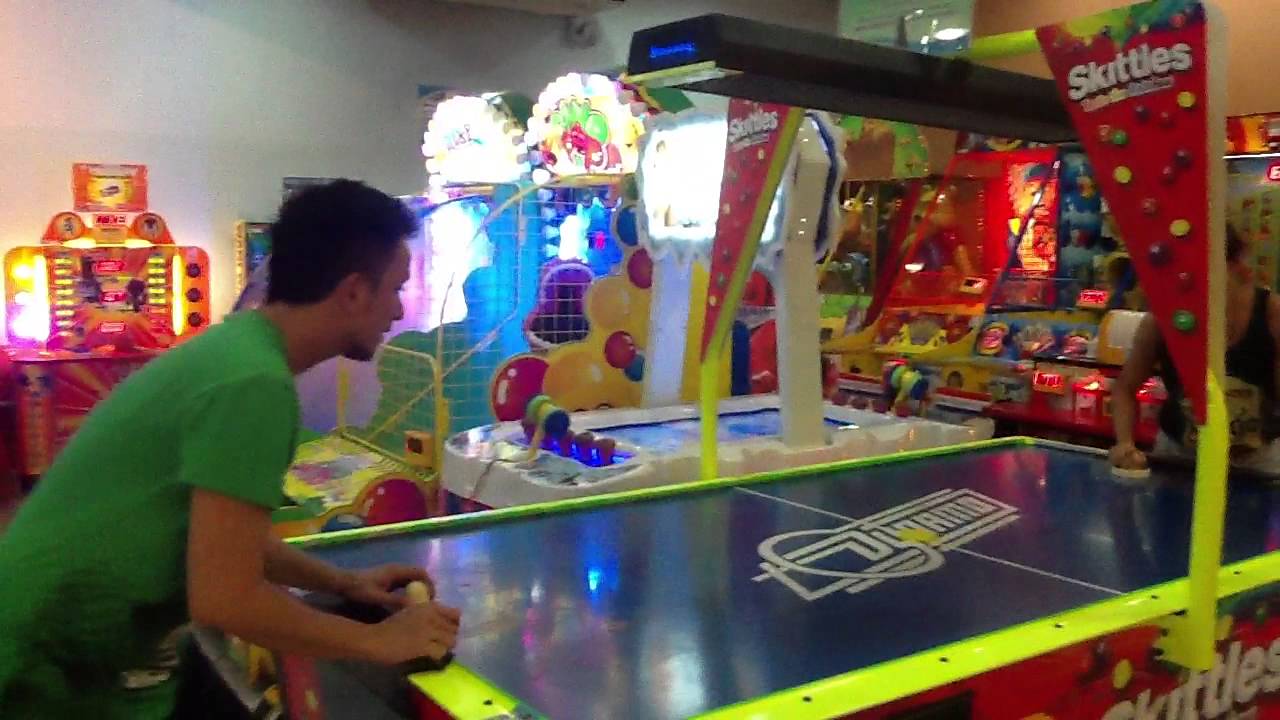 Playing air hockey at Timezone YouTube