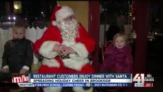 Santa Claus joins families for dinner
