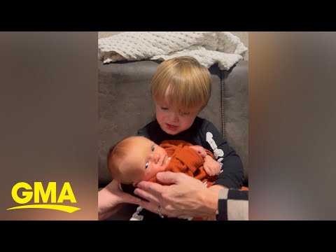 Toddler knows the perfect lullaby to sing to his baby brother: 'we will rock you'